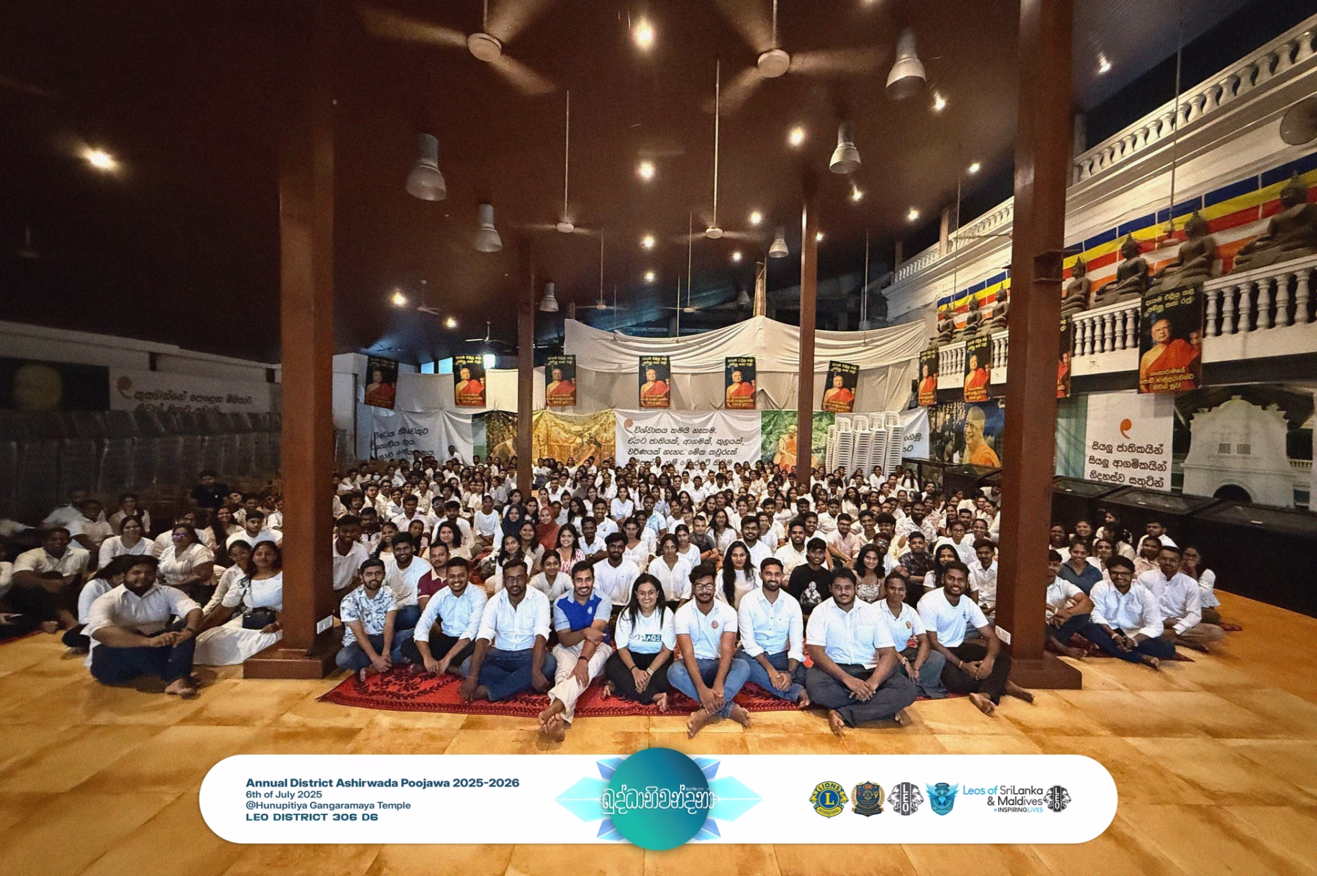 Hundreds of Leos seated together in prayer during Buddhabhiwandana 2025 at Gangaramaya Temple, Colombo.